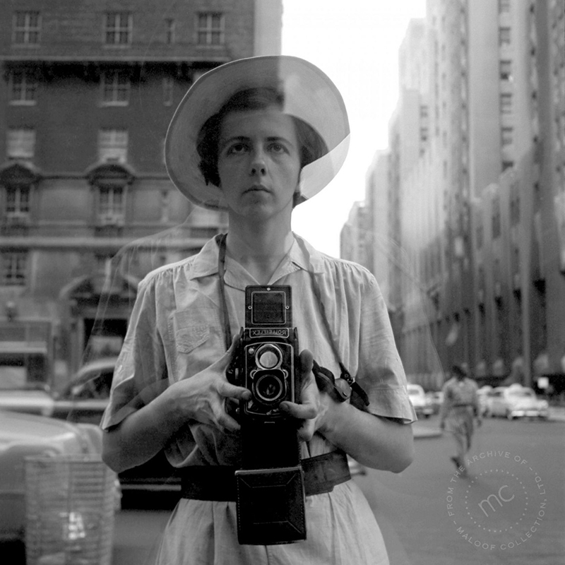 Vivian Maier, Self Portrait Mirror Red Clothing Shop © Maloof Collection Associated Press